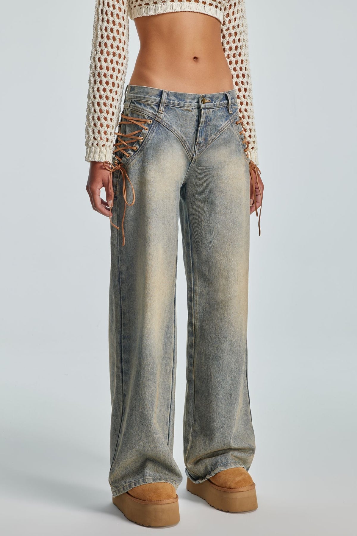 Close view of the Regan Jeans lace-up side detail